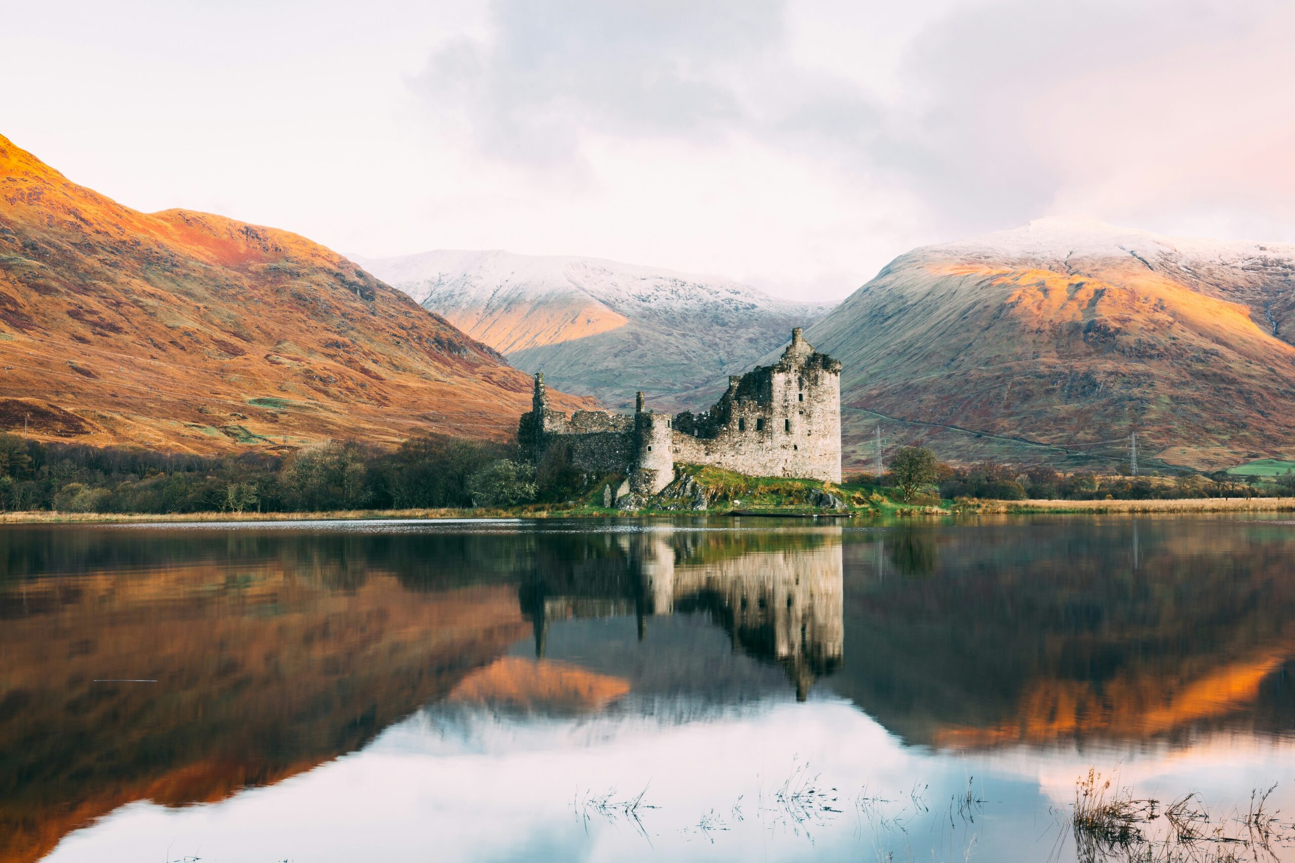 misty Scottish Highlands mountain and lake landscape